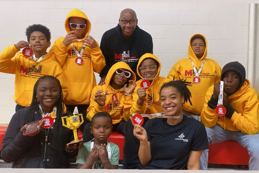 Diverse people wearing medal